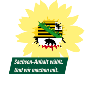 Das bündnisgrüne Sonnenblumen-Logo. Im Ausschnitt für den Blumenkorb das Landeswappen von Sachsen-Anhalt. Dzu der Text "Sachsen-Anhalt wählt. Und wir machen mit."