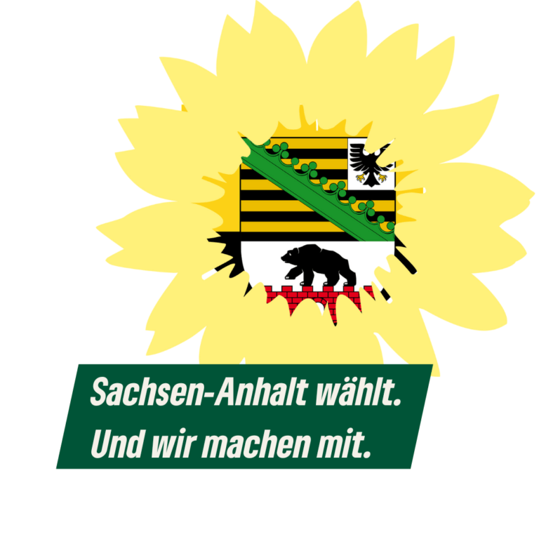 Das bündnisgrüne Sonnenblumen-Logo. Im Ausschnitt für den Blumenkorb das Landeswappen von Sachsen-Anhalt. Dzu der Text "Sachsen-Anhalt wählt. Und wir machen mit."